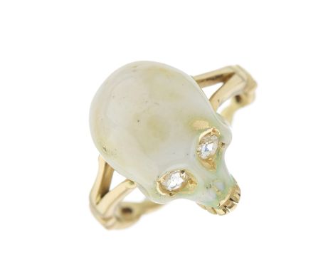 An 18ct gold white enamel skull ring, with rose-cut diamond eyes and openwork band, hallmarks for London, ring size N, 7.8gCo