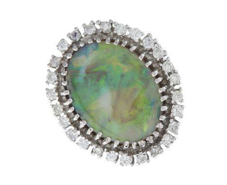 A mid 20th century oval opal cabochon and brilliant-cut diamond cluster dress ring, with grooved shoulders, opal measures app