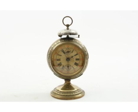 Brass travel alarm clock with bell and paper dial, ca. 1900,  Junghans, h. 21,5 cm.Messing reiswekker met bel en papieren wij