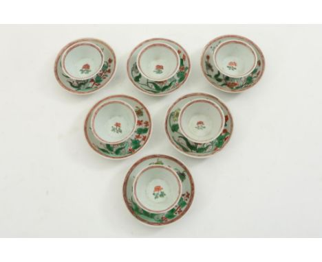 A set of 6 porcelain cups and saucers with Famille Verte  decorations of flower and butterflies, marked in double circle,  Ch