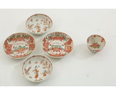 A set of porcelain saucers with red decor of long lisa and little  fool, with gold decor, hereby 1 cup and 2 saucers with  'A