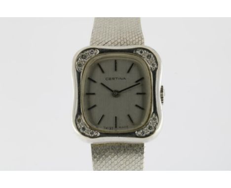 A white gold ladies wrist watch, manual winding, Certina, square  case set with brilliant cut diamonds in all corners and whi