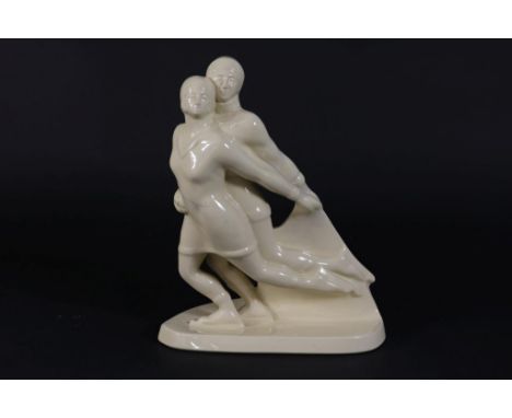 Cream ceramic Art Deco molding as a skating couple, marked BFK- Ch. Calleav, France 1930s, h. 32, w. 26, d. 14 cm.Creme keram