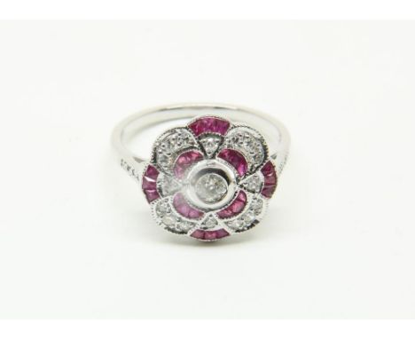 White gold ring mounted with rubies 0.65ct. and old mines cut  diamonds 0.33ct. G. size 17.25 585/000Witgouden fantasiering b