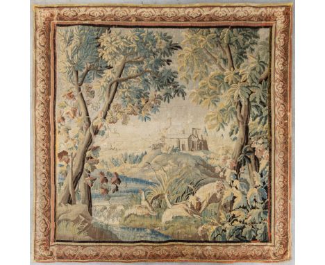 An antique 'Verdure' tapissery, Decorated with a castle, fauna and flora. 17th C.Condition report: - The carpet is shortened-