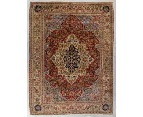 An Oriental hand-made carpet, Ghoum.Dimensions: (L:264 x W:353 cm)