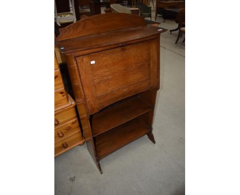 A late 19th or early 20th Century oak bureau having double shelf under, locks removed