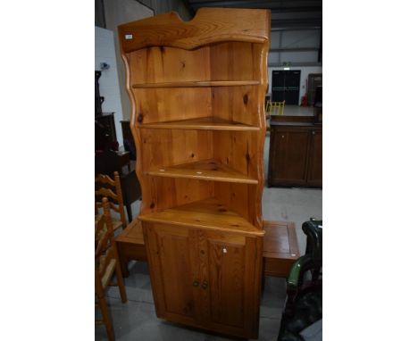 A vintage yellow pine corner shelf with cupboard under