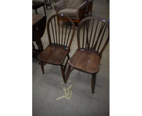 A pair of traditional hoop and stick back kitchen chairs