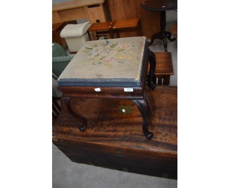 A Victorian rosewood dressing table stool having tapestry top and shaped legs