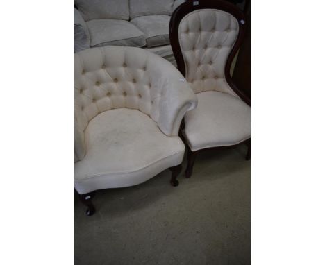 A reproduction spoon back nursing chair and similar upholstered button back tub chair