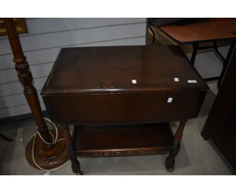 A dark stained Ercol tea trolley