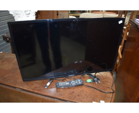 A Polaroid 32' TV, with remote