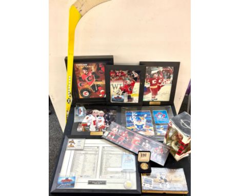 Large selection of Hockey NFL memorabilia to include signed photos, collector coins, bobble head, hockey stick etc
