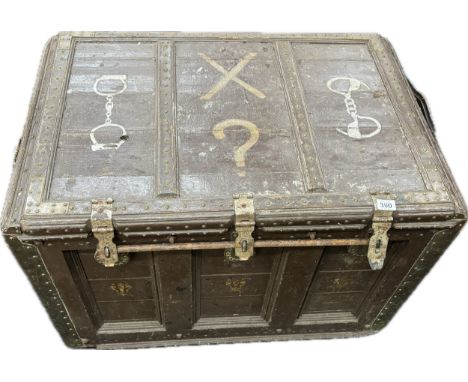 Antique escapology trunk on casters with chains, measures approximately 29 inches tall 38 inches wide 27 depth