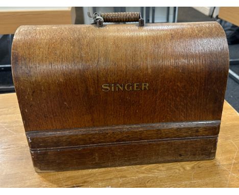 Vintage cased Singer sewing machine with key