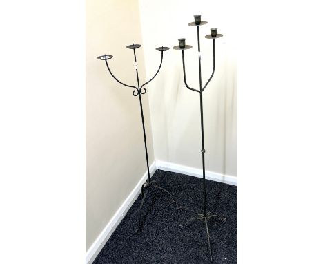 Cast iron candle stick holders tallest measures approximately 49 inches tall