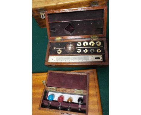 Four cased scientific instruments to inc a hydrometer