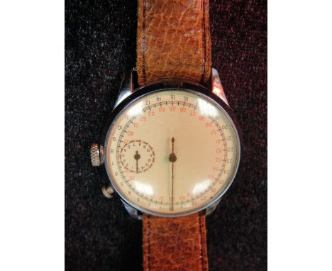 A vintage wrist-worn stopwatch with subsidiary dial