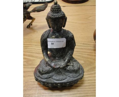 A bronze figure of a buddah