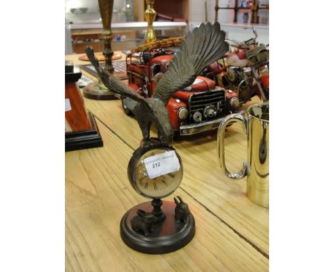 A desk clock with eagle finial