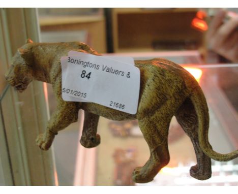 A cold-painted bronze of a lion