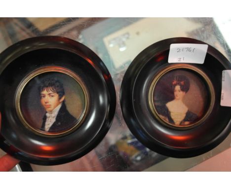 A pair of framed portrait miniatures