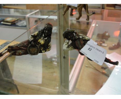 A pair of cold-painted bronze musicians