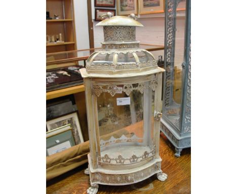 A medium metal and glass garden lantern