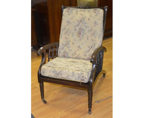 A vintage reclining armchair, possibly by Jas Schoolbred London, no stamp, raised on ceramic castors, 90cm high