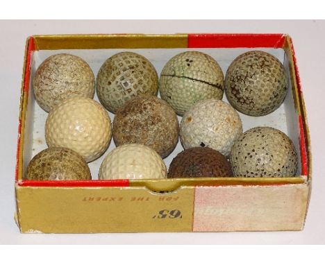 Eleven assorted gutty and vintage golf balls, to include 'The Challenger', Spalding, Campbell 1, US Tru Blue 3 etc, in a Dunl