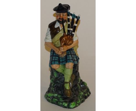 A Royal Doulton figure 'The Piper', HN 2907, 20cm high   CONDITION REPORT:  Lot 160 - slight rougher feel to end of tallest p