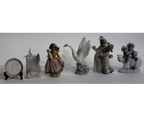 A mixed lot of Lladro and Nao figures, comprising of a Lladro matt glazed 'Peasant Girl' figure, Lladro 'Eskimo Riders' figur