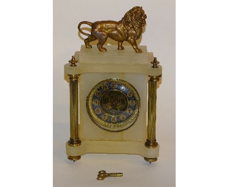 A French alabaster and gilt metal mantel clock, the gilded lion surmount above blue enamel dial with Arabic numerals and skel