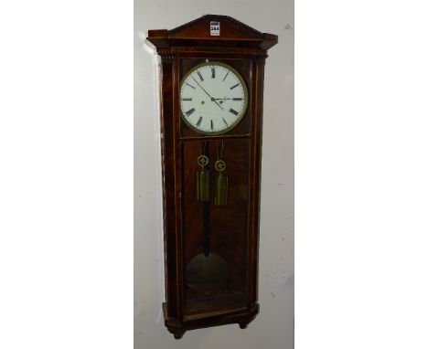 A mahogany and line inlaid regulator wall clock circa late 19th century, with twin train movement, the glazed door enclosing 