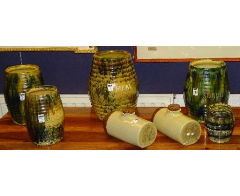Four Seaton style Scottish salt glazed storage jars, of mottled blue, green and brown glaze, two for 'Meal', two for 'Sugar' 