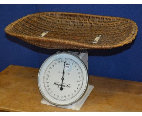 A set of vintage baby scales by Waymaster, max weight 28lbs, with wicker top, 35cm high x 62cm wide