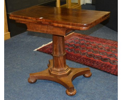 A William IV mahogany tea table, the fold over mechanism a/f, raised on octagonal column support and quadripartite platform b