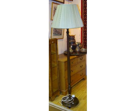 A vintage mahogany floor lamp with shade, fitted for electricity, 153cm high