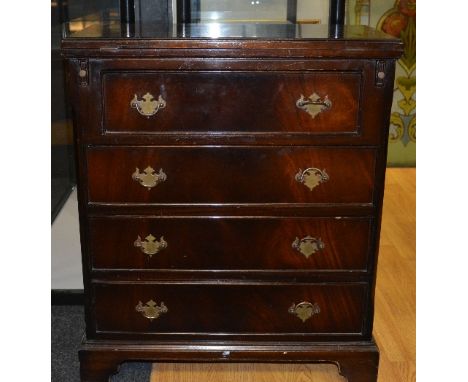 A reproduction chest of drawers, with pullout slides and four graduated drawers raised on bracket supports, 76cm high x 63cm 