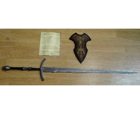 A Lord of the Rings limited edition reproduction 'Sword of the Witch King', with certificate of authenticity and wooden plint