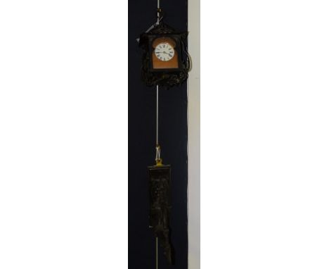 A French twin train clock housed in a wrought iron wall hanging lantern casing, with candle sconce and wall bracket