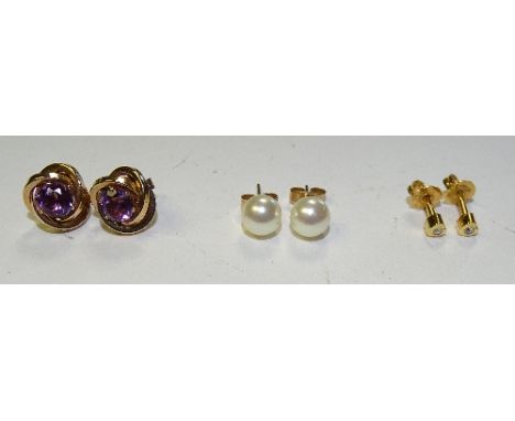 Three pairs of stud earrings, to include a pair of 14ct gold amethyst earrings (missing one butterfly), 1.5g, a pair of 9ct g