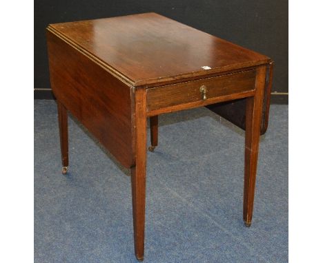 A 19th century mahogany Pembroke table, with drop leaves and drawer to one end, raised on tapered supports with ceramic casto