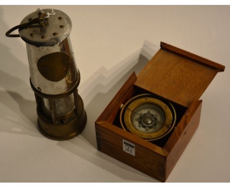 A vintage miners safety lamp, 23cm high, together with a boxed desk compass, raised on gimble cradle (2)