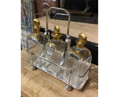 SILVER PLATE TANTALUS WITH GILT BOTTLE