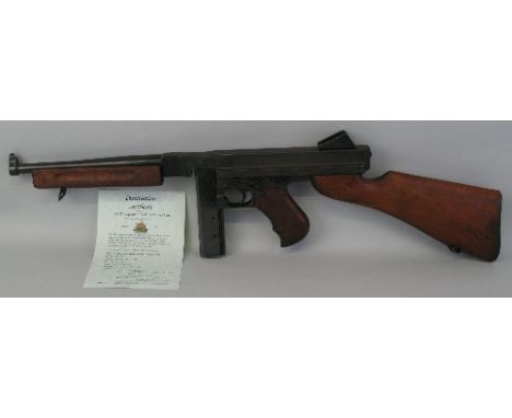 A deactivated Thompson sub-machine gun, stamped "Caliber .45 MI no. 154116", on one side and "Auto-Ordnance Corporation, Brid