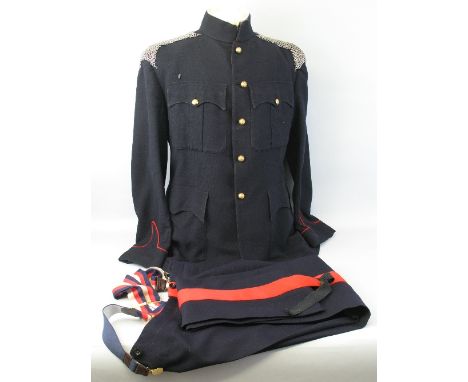 A dress blues uniform, with Royal Ordnance Corps buttons and chain mail epaulettes 