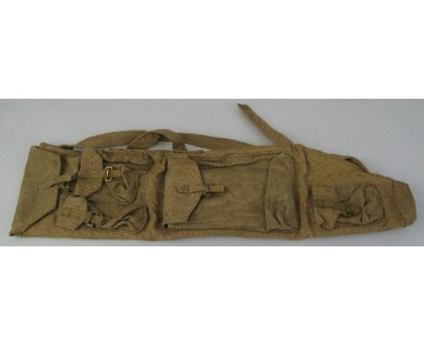 A World War II canvas carry bag, for a Bren gun spare barrel, with shoulder strap, stamped R P Ltd 1944, 69cm long, with orig
