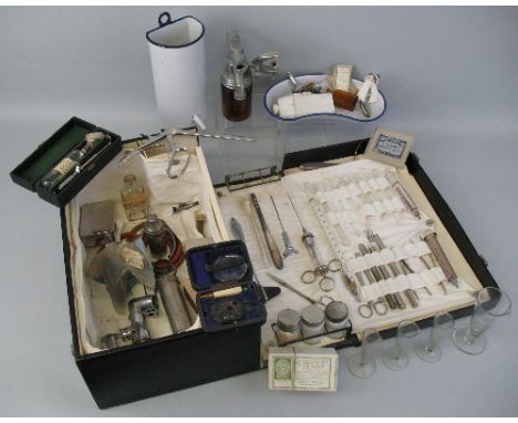 A midwives travelling case, bearing label W H Bailey Limited Oxford Street, London, of oblong form, the double hinged lid ope